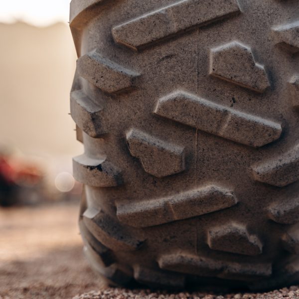 Big ATV wheel up close in the desert. An important part of an ATV