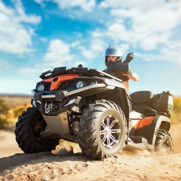 Summer offroad adventure on atv in sand quarry